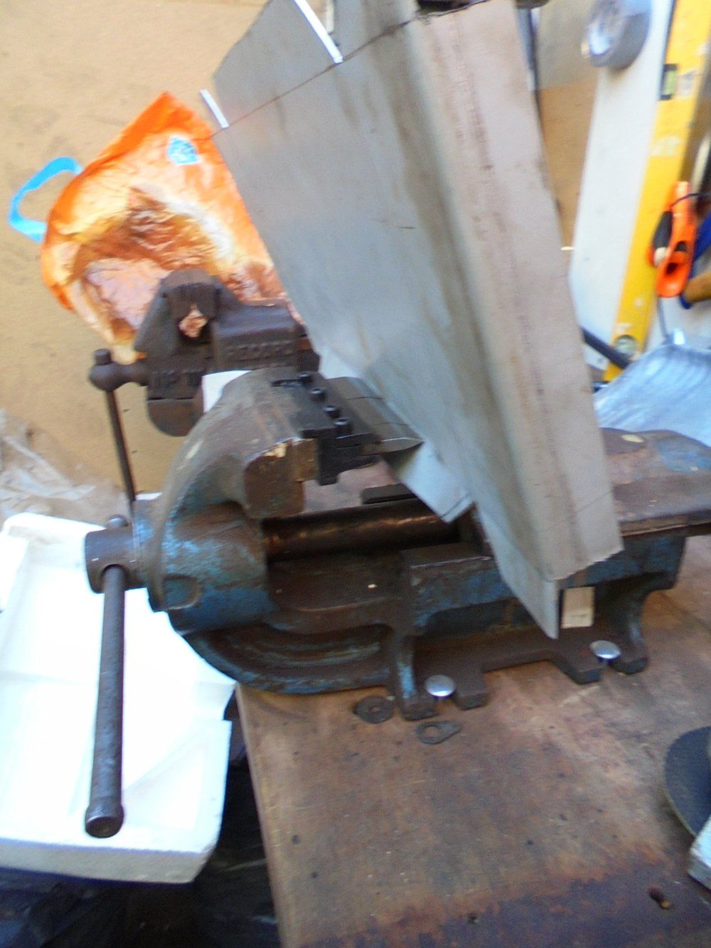 1965 series 2a station wagon battery box bending in the vice.JPG