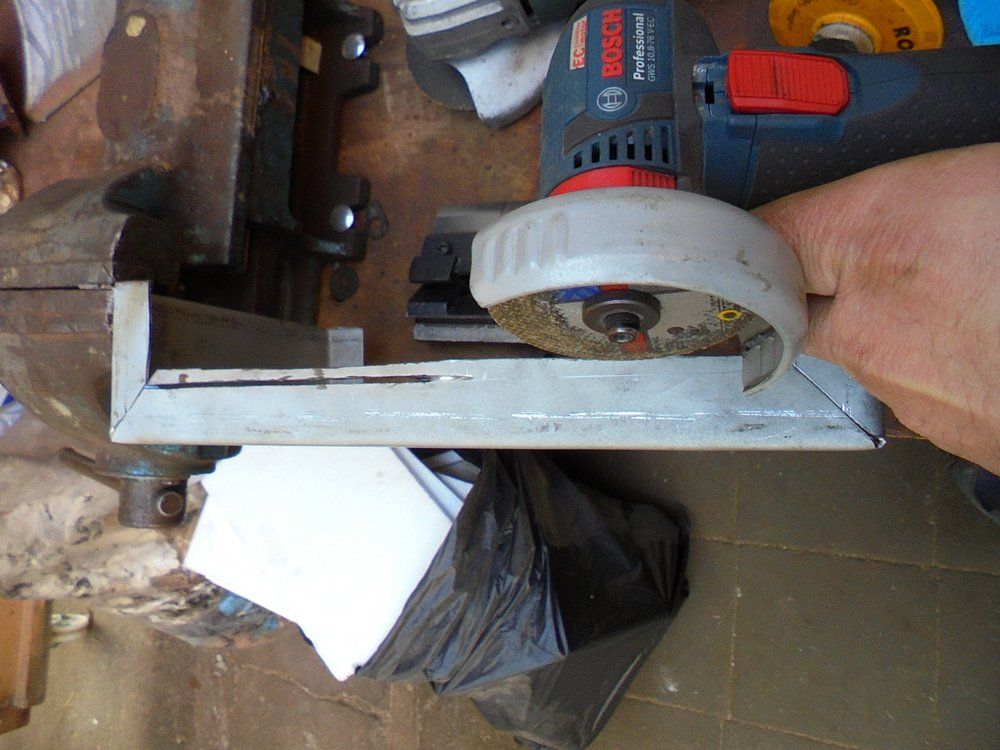 1965 series 2a station wagon battery box trimming with angle grinder.JPG