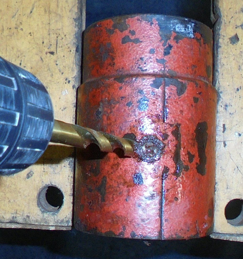 1965 series 2a station wagon dynamo drilling out magnet screws.JPG
