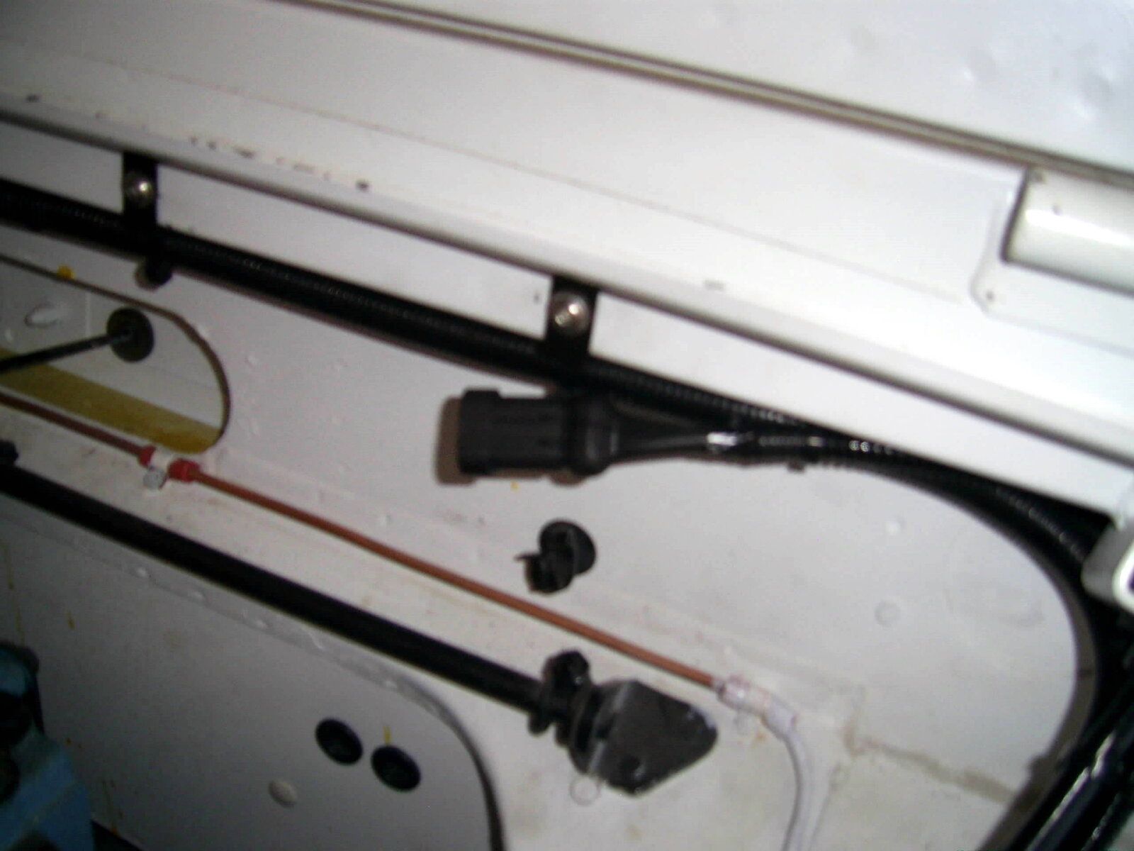 battery positive lead route along bulkhead.JPG