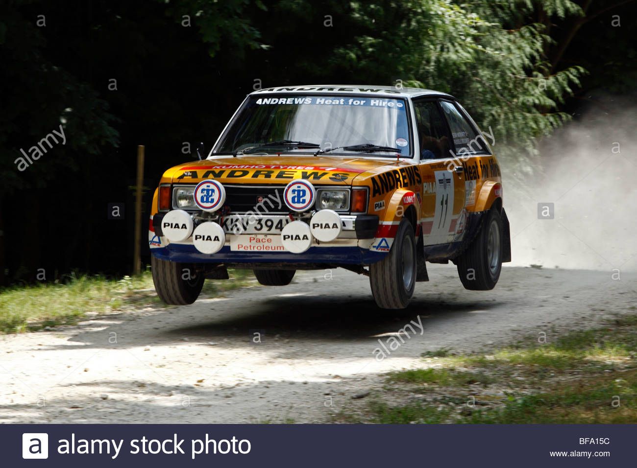 talbot-sunbeam-lotus-driven-by-russell-brookes-over-the-jump-on-the-BFA15C.jpg