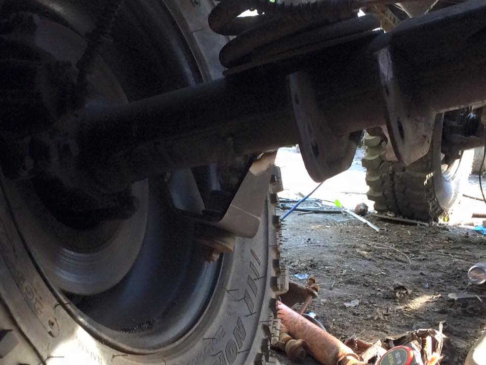 yellow 90 rear shock axle bracket.jpg