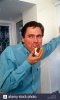 man-male-posing-lifestyle-indoors-eating-cake-CR4Y7R.jpg