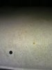 underside_of_headlining_rust_spots_cover_fabric_where_touches_metal_roof.jpg