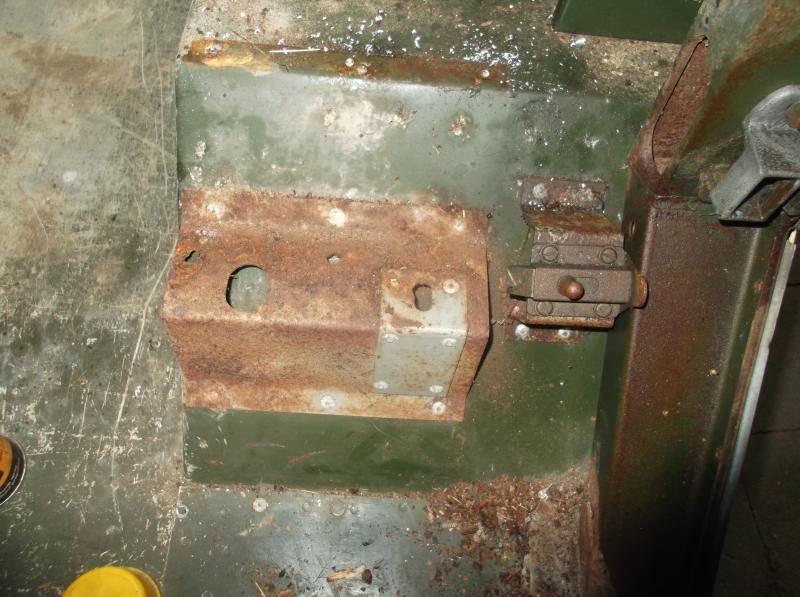 1965 series 2a station wagon drilling out the rear seat supports3.JPG