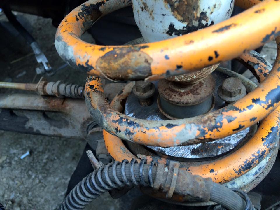 yellow 90 front shock lower mount.jpg